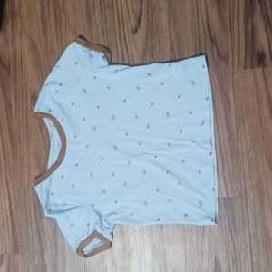 blue shirt with brown butterflies